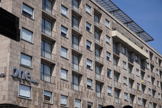 Angle view of a modern hotel facade in Guadalajara, showcasing urban architecture.